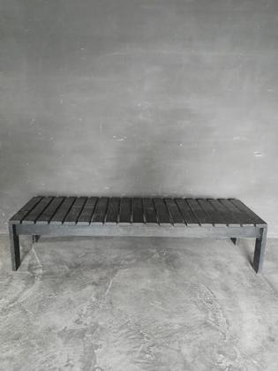 A black wooden slated bench