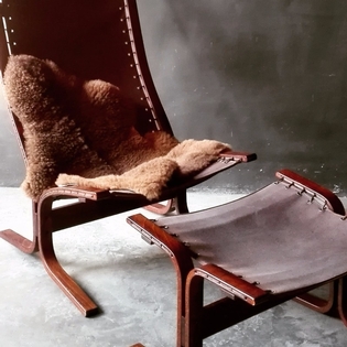 A brown canvas Relling lounge chair, Westnofa