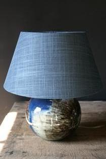 A ceramic small table lamp with bleu grey shade