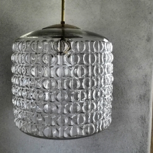 A glass pendant lamp with brass top 