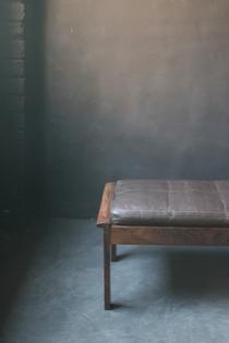 A palissander stool with nicely patinated leather cushion