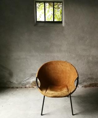 A suede balloon chair by Lush&Co
