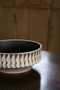Ceramic brown and cream colored bowl