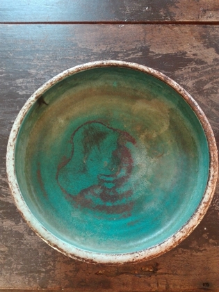 Green and blue ceramic round plate