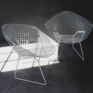 Pair of white Bertoia diamond chairs