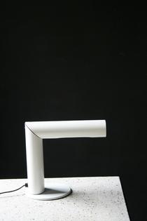 Rotating white metal table lamp